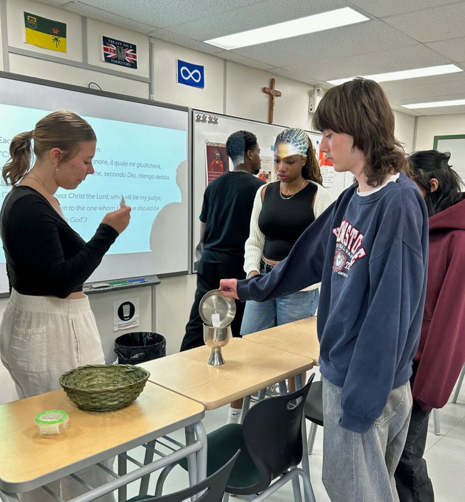 Student-Conclave-Ballots-into-chalice-IMG_5105-by-W-Dale-948x1024.jpg