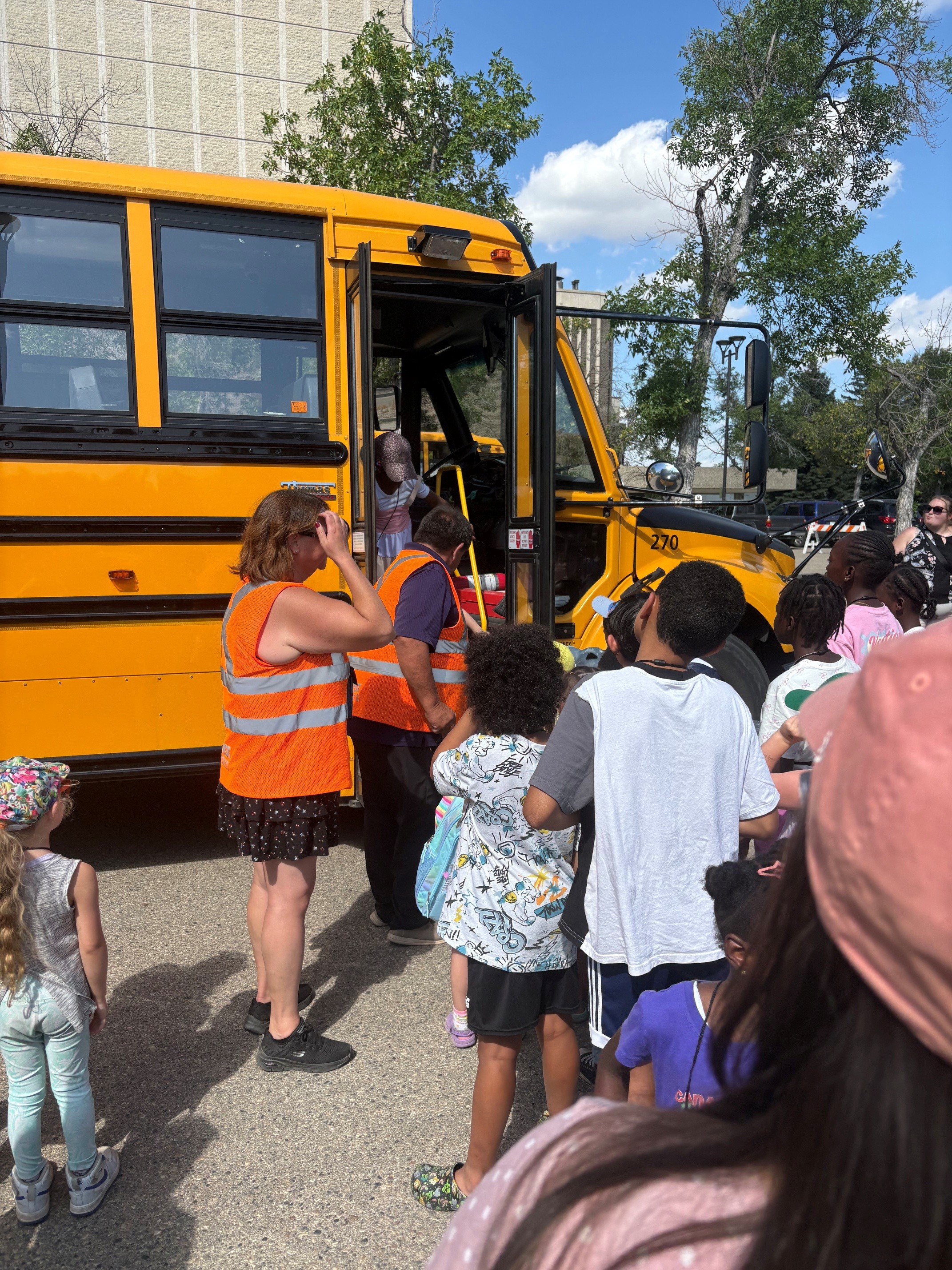 Students get on a yellow school bus at First Ride 2026