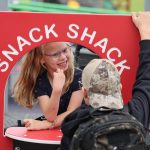 McKenna Hiebert playing at the new accessible playground at St. Anne School
